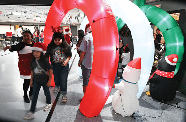 Elks Kids coming thru balloon arch web